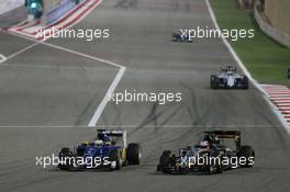 (L to R): Marcus Ericsson (SWE) Sauber C34 and Nico Hulkenberg (GER) Sahara Force India F1 VJM08 battle for position. 19.04.2015. Formula 1 World Championship, Rd 4, Bahrain Grand Prix, Sakhir, Bahrain, Race Day.