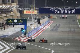Lewis Hamilton (GBR) Mercedes AMG F1 W06 leads out of the pis as Nico Rosberg (GER) Mercedes AMG F1 W06 and Sebastian Vettel (GER) Ferrari SF15-T vfp. 19.04.2015. Formula 1 World Championship, Rd 4, Bahrain Grand Prix, Sakhir, Bahrain, Race Day.