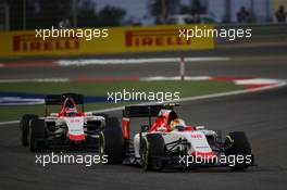 Roberto Merhi (ESP) Manor Marussia F1 Team leads team mate Will Stevens (GBR) Manor Marussia F1 Team. 19.04.2015. Formula 1 World Championship, Rd 4, Bahrain Grand Prix, Sakhir, Bahrain, Race Day.