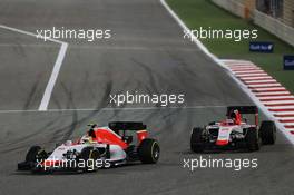 Roberto Merhi (ESP) Manor Marussia F1 Team leads Will Stevens (GBR) Manor Marussia F1 Team. 19.04.2015. Formula 1 World Championship, Rd 4, Bahrain Grand Prix, Sakhir, Bahrain, Race Day.