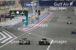 (L to R): Romain Grosjean (FRA) Lotus F1 E23 and Nico Hulkenberg (GER) Sahara Force India F1 VJM08 battle for position. 19.04.2015. Formula 1 World Championship, Rd 4, Bahrain Grand Prix, Sakhir, Bahrain, Race Day.