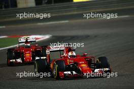 Sebastian Vettel (GER) Ferrari SF15-T leads team mate Kimi Raikkonen (FIN) Ferrari SF15-T. 19.04.2015. Formula 1 World Championship, Rd 4, Bahrain Grand Prix, Sakhir, Bahrain, Race Day.