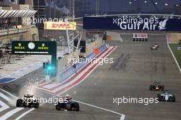 (L to R): Pastor Maldonado (VEN) Lotus F1 E23 and Max Verstappen (NLD) Scuderia Toro Rosso STR10 battle for position. 19.04.2015. Formula 1 World Championship, Rd 4, Bahrain Grand Prix, Sakhir, Bahrain, Race Day.