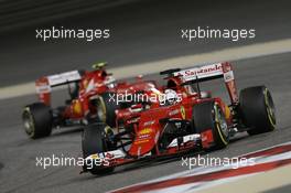 Sebastian Vettel (GER) Ferrari SF15-T leads team mate Kimi Raikkonen (FIN) Ferrari SF15-T. 19.04.2015. Formula 1 World Championship, Rd 4, Bahrain Grand Prix, Sakhir, Bahrain, Race Day.