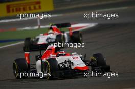Will Stevens (GBR) Manor Marussia F1 Team leads team mate Roberto Merhi (ESP) Manor Marussia F1 Team. 19.04.2015. Formula 1 World Championship, Rd 4, Bahrain Grand Prix, Sakhir, Bahrain, Race Day.