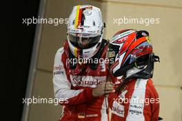Kimi Raikkonen (FIN), Scuderia Ferrari ans Sebastian Vettel (GER), Scuderia Ferrari  18.04.2015. Formula 1 World Championship, Rd 4, Bahrain Grand Prix, Sakhir, Bahrain, Qualifying Day.