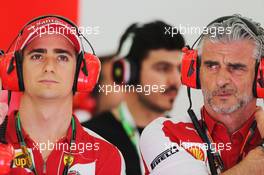 (L to R): Esteban Gutierrez (MEX) Ferrari Test and Reserve Driver with Maurizio Arrivabene (ITA) Ferrari Team Principal. 18.04.2015. Formula 1 World Championship, Rd 4, Bahrain Grand Prix, Sakhir, Bahrain, Qualifying Day.