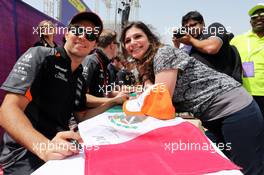 Sergio Perez (MEX) Sahara Force India F1 and Nico Hulkenberg (GER) Sahara Force India F1 sign autographs for the fans. 18.04.2015. Formula 1 World Championship, Rd 4, Bahrain Grand Prix, Sakhir, Bahrain, Qualifying Day.