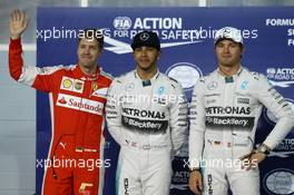 Pole for Lewis Hamilton (GBR) Mercedes AMG F1, 2nd for Sebastian Vettel (GER) Ferrari SF15-T and 3rd for Nico Rosberg (GER) Mercedes AMG F1 W06. 18.04.2015. Formula 1 World Championship, Rd 4, Bahrain Grand Prix, Sakhir, Bahrain, Qualifying Day.