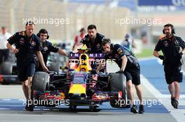 The Red Bull Racing RB11 of Daniil Kvyat (RUS) Red Bull Racing is pushed down the pit lane by mechanics in the third practice session. 18.04.2015. Formula 1 World Championship, Rd 4, Bahrain Grand Prix, Sakhir, Bahrain, Qualifying Day.