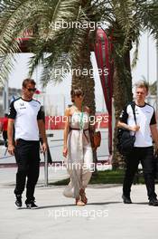 (L to R): Jenson Button (GBR) McLaren with wife Jessica Button (JPN) and Kevin Magnussen (DEN) McLaren Test and Reserve Driver. 18.04.2015. Formula 1 World Championship, Rd 4, Bahrain Grand Prix, Sakhir, Bahrain, Qualifying Day.