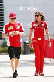 Kimi Raikkonen (FIN) Ferrari with Stefania Bocchi (ITA) Ferrari Press Officer. 18.04.2015. Formula 1 World Championship, Rd 4, Bahrain Grand Prix, Sakhir, Bahrain, Qualifying Day.
