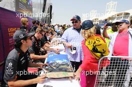 Sergio Perez (MEX) Sahara Force India F1 and Nico Hulkenberg (GER) Sahara Force India F1 sign autographs for the fans. 18.04.2015. Formula 1 World Championship, Rd 4, Bahrain Grand Prix, Sakhir, Bahrain, Qualifying Day.