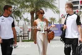 (L to R): Jenson Button (GBR) McLaren with wife Jessica Button (JPN) and Kevin Magnussen (DEN) McLaren Test and Reserve Driver. 18.04.2015. Formula 1 World Championship, Rd 4, Bahrain Grand Prix, Sakhir, Bahrain, Qualifying Day.