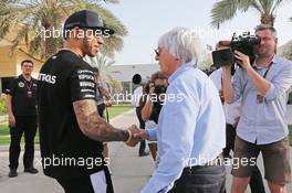 (L to R): Lewis Hamilton (GBR) Mercedes AMG F1 with Bernie Ecclestone (GBR). 16.04.2015. Formula 1 World Championship, Rd 4, Bahrain Grand Prix, Sakhir, Bahrain, Preparation Day.