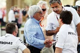 (L to R): Paddy Lowe (GBR) Mercedes AMG F1 Executive Director (Technical) with Bernie Ecclestone (GBR); Pasquale Lattuneddu (ITA) of the FOM; and Toto Wolff (GER) Mercedes AMG F1 Shareholder and Executive Director. 16.04.2015. Formula 1 World Championship, Rd 4, Bahrain Grand Prix, Sakhir, Bahrain, Preparation Day.