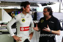 (L to R): Jolyon Palmer (GBR) Lotus F1 Team Test and Reserve Driver with Julien Simon-Chautemps (FRA) Lotus F1 Team Race Engineer. 13.11.2015. Formula 1 World Championship, Rd 18, Brazilian Grand Prix, Sao Paulo, Brazil, Practice Day.