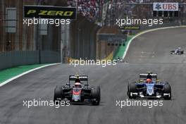 Jenson Button (GBR), McLaren Honda and Felipe Nasr (BRA), Sauber F1 Team  15.11.2015. Formula 1 World Championship, Rd 18, Brazilian Grand Prix, Sao Paulo, Brazil, Race Day.