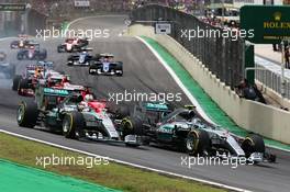 Nico Rosberg (GER) Mercedes AMG F1 W06 leads team mate Lewis Hamilton (GBR) Mercedes AMG F1 W06 at the start of the race. 15.11.2015. Formula 1 World Championship, Rd 18, Brazilian Grand Prix, Sao Paulo, Brazil, Race Day.