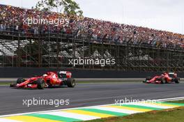 Sebastian Vettel (GER) Ferrari SF15-T lead team mate Kimi Raikkonen (FIN) Ferrari SF15-T. 15.11.2015. Formula 1 World Championship, Rd 18, Brazilian Grand Prix, Sao Paulo, Brazil, Race Day.