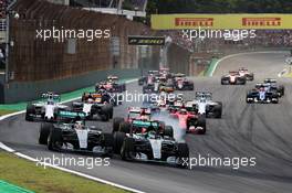 Nico Rosberg (GER) Mercedes AMG F1 W06 (Right) leads team mate Lewis Hamilton (GBR) Mercedes AMG F1 W06 at the start of the race. 15.11.2015. Formula 1 World Championship, Rd 18, Brazilian Grand Prix, Sao Paulo, Brazil, Race Day.