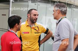 Cyril Abiteboul (FRA) Renault Sport F1 Managing Director (Centre) with Dieter Gass (GER) Audi Sport Head of DTM (Right). 15.11.2015. Formula 1 World Championship, Rd 18, Brazilian Grand Prix, Sao Paulo, Brazil, Race Day.