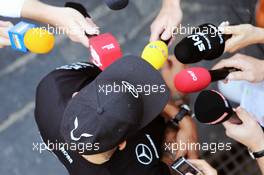 Lewis Hamilton (GBR) Mercedes AMG F1 with the media. 12.11.2015. Formula 1 World Championship, Rd 18, Brazilian Grand Prix, Sao Paulo, Brazil, Preparation Day.