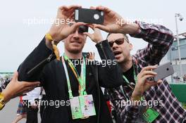 (L to R): Michael Fassbender (IRE) Actor with Bryan Singer (GBR) Film Director (Right) on the grid. 07.06.2015. Formula 1 World Championship, Rd 7, Canadian Grand Prix, Montreal, Canada, Race Day.