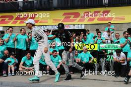 Race winner Lewis Hamilton (GBR) Mercedes AMG F1 celebrates with team mate Nico Rosberg (GER) Mercedes AMG F1 and the team. 07.06.2015. Formula 1 World Championship, Rd 7, Canadian Grand Prix, Montreal, Canada, Race Day.
