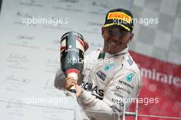 Rwe Lewis Hamilton (GBR) Mercedes AMG F1 celebrates with the champagne on the podium. 07.06.2015. Formula 1 World Championship, Rd 7, Canadian Grand Prix, Montreal, Canada, Race Day.