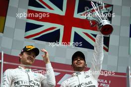 Race winner Lewis Hamilton (GBR) Mercedes AMG F1 (Right) celebrates on the podium with second placed team mate Nico Rosberg (GER) Mercedes AMG F1. 07.06.2015. Formula 1 World Championship, Rd 7, Canadian Grand Prix, Montreal, Canada, Race Day.