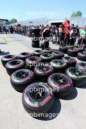 McLaren mechanic with Pirelli tyres in the pits. 04.06.2015. Formula 1 World Championship, Rd 7, Canadian Grand Prix, Montreal, Canada, Preparation Day.