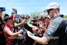 Nico Hulkenberg (GER) Sahara Force India F1 signs autographs for the fans. 04.06.2015. Formula 1 World Championship, Rd 7, Canadian Grand Prix, Montreal, Canada, Preparation Day.