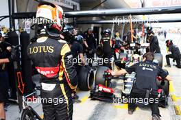Romain Grosjean (FRA) Lotus F1 E23 watches Pastor Maldonado (VEN) Lotus F1 E23 in the pits. 10.04.2015. Formula 1 World Championship, Rd 3, Chinese Grand Prix, Shanghai, China, Practice Day.