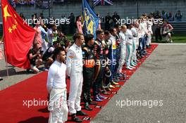 The grid observes the national anthem. 12.04.2015. Formula 1 World Championship, Rd 3, Chinese Grand Prix, Shanghai, China, Race Day.