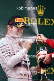 Nico Rosberg (GER) Mercedes AMG F1 celebrates his second position with the champagne on the podium. 12.04.2015. Formula 1 World Championship, Rd 3, Chinese Grand Prix, Shanghai, China, Race Day.