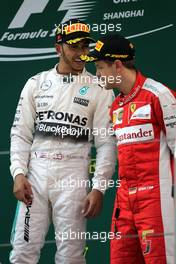 Lewis Hamilton (GBR), Mercedes AMG F1 Team and Sebastian Vettel (GER), Scuderia Ferrari  12.04.2015. Formula 1 World Championship, Rd 3, Chinese Grand Prix, Shanghai, China, Race Day.