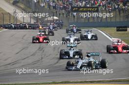 Lewis Hamilton (GBR) Mercedes AMG F1 W06 leads at the start of the race. 12.04.2015. Formula 1 World Championship, Rd 3, Chinese Grand Prix, Shanghai, China, Race Day.