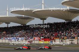 Roberto Merhi (SPA), Manor F1 Team and Will Stevens (GBR), Manor F1 Team  12.04.2015. Formula 1 World Championship, Rd 3, Chinese Grand Prix, Shanghai, China, Race Day.
