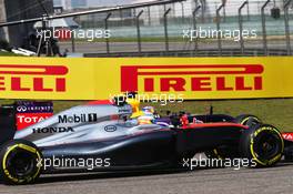 Fernando Alonso (ESP) McLaren MP4-30 and Daniel Ricciardo (AUS) Red Bull Racing RB11 battle for position. 12.04.2015. Formula 1 World Championship, Rd 3, Chinese Grand Prix, Shanghai, China, Race Day.