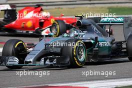 Nico Rosberg (GER), Mercedes AMG F1 Team and Sebastian Vettel (GER), Scuderia Ferrari  12.04.2015. Formula 1 World Championship, Rd 3, Chinese Grand Prix, Shanghai, China, Race Day.