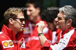 (L to R): Sebastian Vettel (GER) Ferrari with Maurizio Arrivabene (ITA) Ferrari Team Principal. 11.04.2015. Formula 1 World Championship, Rd 3, Chinese Grand Prix, Shanghai, China, Qualifying Day.