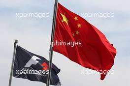 F1 and Chinese flags in the paddock. 09.04.2015. Formula 1 World Championship, Rd 3, Chinese Grand Prix, Shanghai, China, Preparation Day.