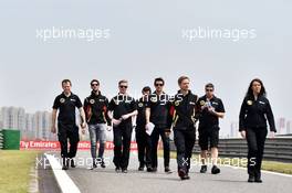 Romain Grosjean (FRA) Lotus F1 Team and Jolyon Palmer (GBR) Lotus F1 Team Test and Reserve Driver walk the circuit with the team. 09.04.2015. Formula 1 World Championship, Rd 3, Chinese Grand Prix, Shanghai, China, Preparation Day.