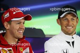 (L to R): Sebastian Vettel (GER) Ferrari with Jenson Button (GBR) McLaren in the FIA Press Conference. 09.04.2015. Formula 1 World Championship, Rd 3, Chinese Grand Prix, Shanghai, China, Preparation Day.