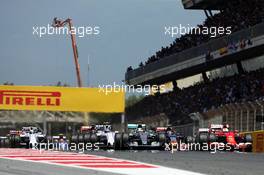 Lewis Hamilton (GBR) Mercedes AMG F1 W06 and Sebastian Vettel (GER) Ferrari SF15-T at the start of the race. 10.05.2015. Formula 1 World Championship, Rd 5, Spanish Grand Prix, Barcelona, Spain, Race Day.