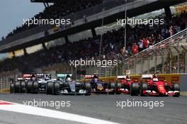 Lewis Hamilton (GBR) Mercedes AMG F1 W06 and Sebastian Vettel (GER) Ferrari SF15-T at the start of the race. 10.05.2015. Formula 1 World Championship, Rd 5, Spanish Grand Prix, Barcelona, Spain, Race Day.