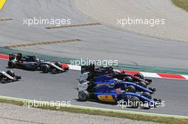 Felipe Nasr (BRA) Sauber C34, Marcus Ericsson (SWE) Sauber C34 and Jenson Button (GBR) McLaren MP4-30 at the start of the race. 10.05.2015. Formula 1 World Championship, Rd 5, Spanish Grand Prix, Barcelona, Spain, Race Day.