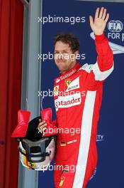 Sebastian Vettel (GER) Ferrari celebrates his third position in qualifying parc ferme. 09.05.2015. Formula 1 World Championship, Rd 5, Spanish Grand Prix, Barcelona, Spain, Qualifying Day.