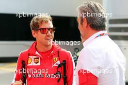 (L to R): Sebastian Vettel (GER) Ferrari with Maurizio Arrivabene (ITA) Ferrari Team Principal. 07.05.2015. Formula 1 World Championship, Rd 5, Spanish Grand Prix, Barcelona, Spain, Preparation Day.